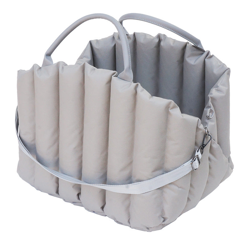 Portable pet carrier for car travel by Dropshipman, showing a compact, breathable carrier with secure clips and handle for pets.