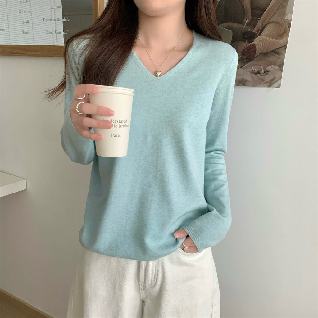 Women's loose V-neck cozy sweater by Dropshipman, soft and perfect for layering, shown in a relaxed fit style.
