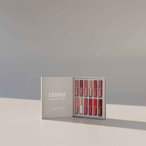 12-color lip glaze set by Dropshipman featuring moisturizing, long-lasting shades in small, sleek containers.