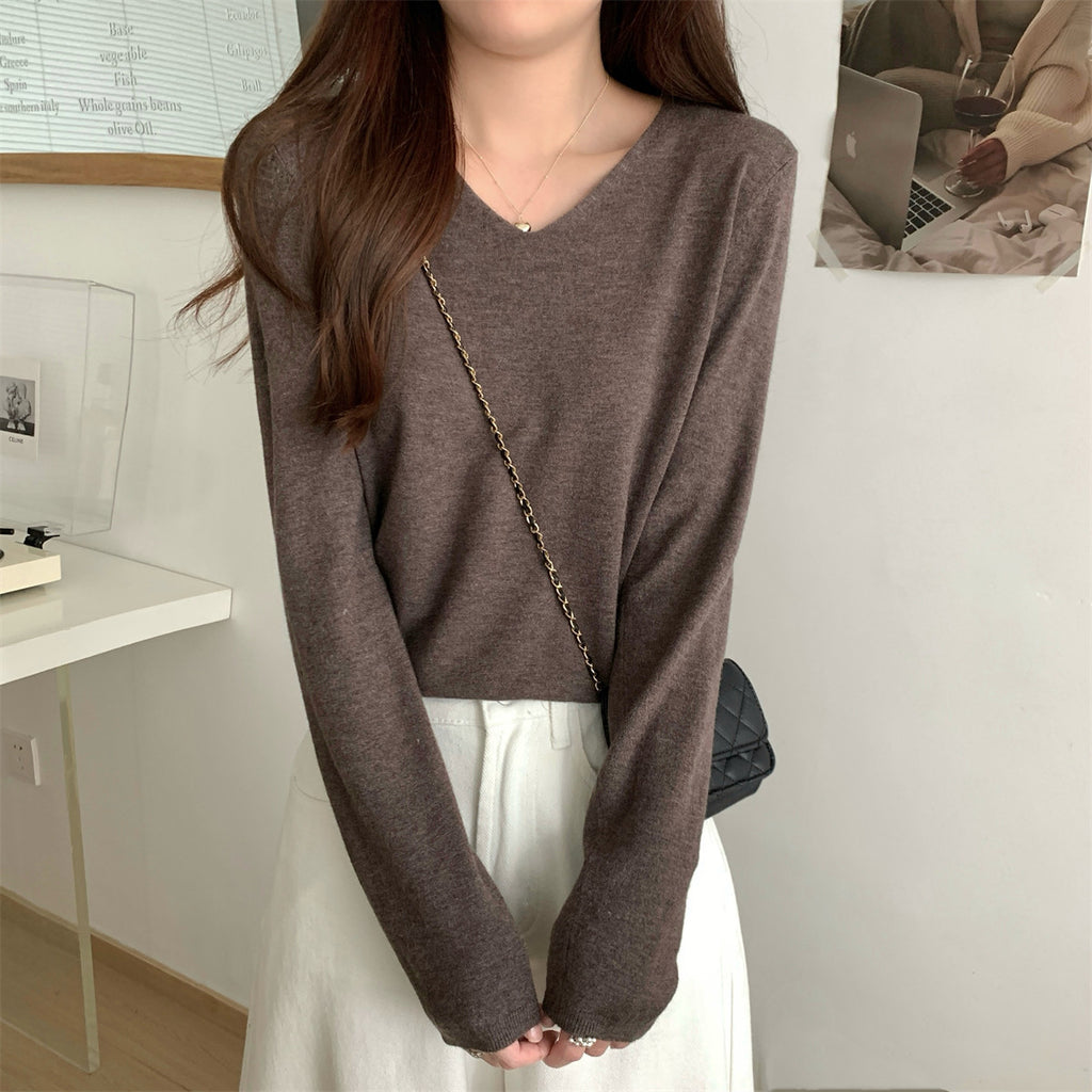 Women's loose V-neck cozy sweater by Dropshipman, soft and ideal for layering, shown in a relaxed fit and comfortable fabric.