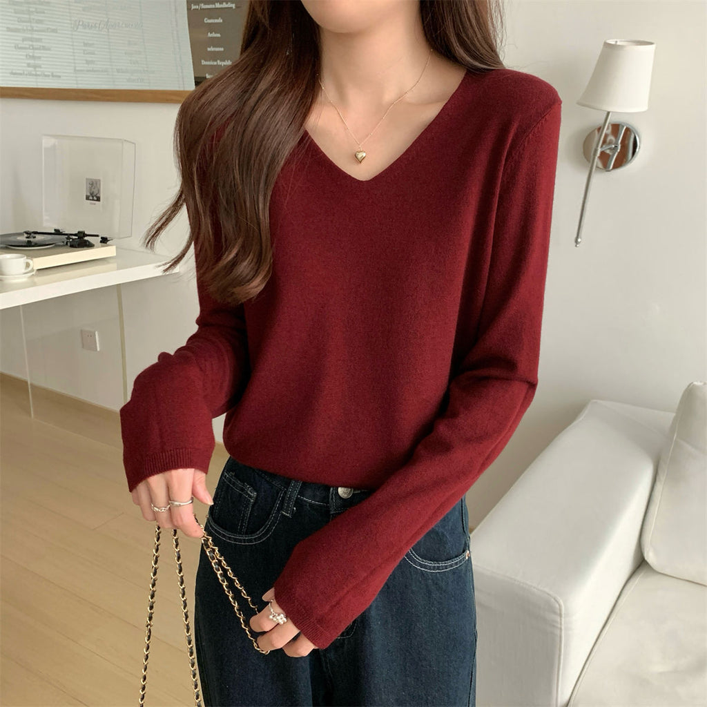 Women's loose V-neck cozy sweater by Dropshipman, soft and comfortable for layering, shown in a relaxed fit on a model.