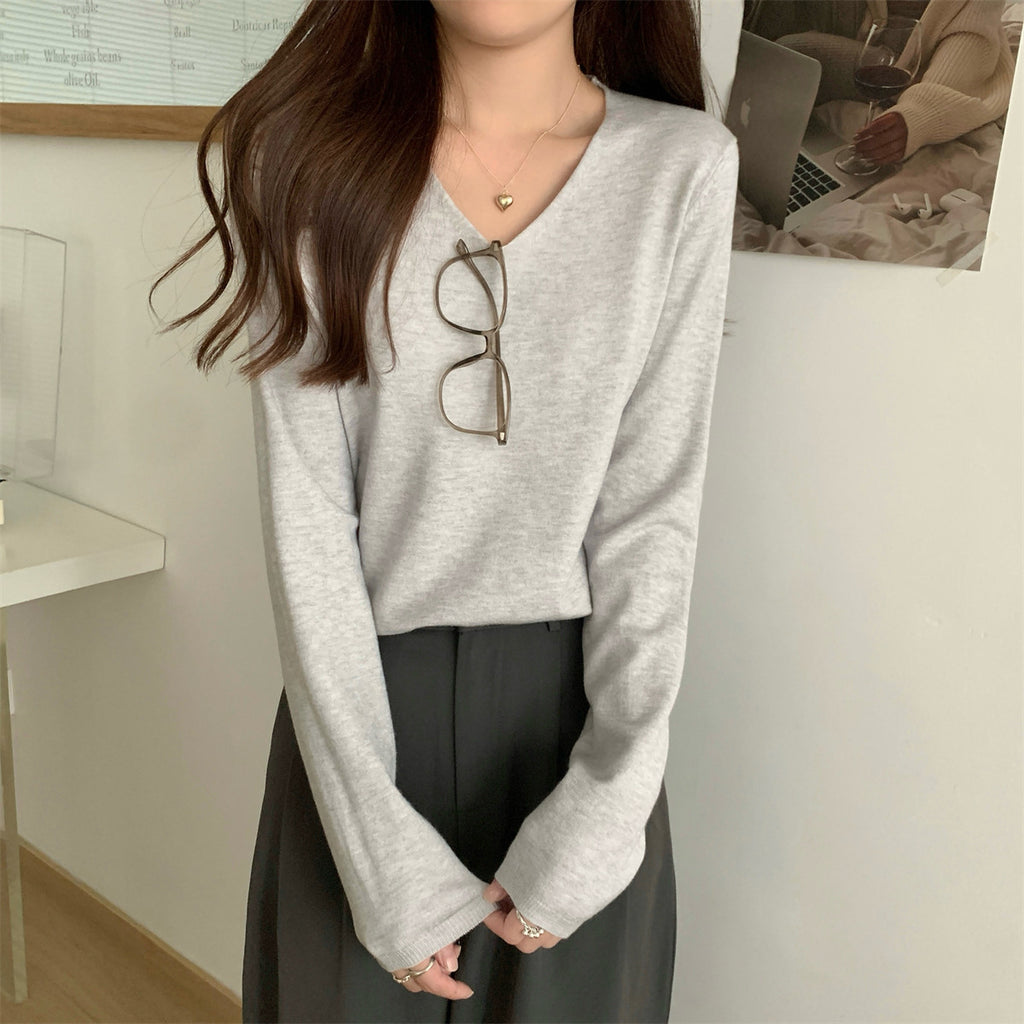 Women's loose V-neck cozy sweater by Dropshipman, soft and perfect for layering, shown in a relaxed fit style.