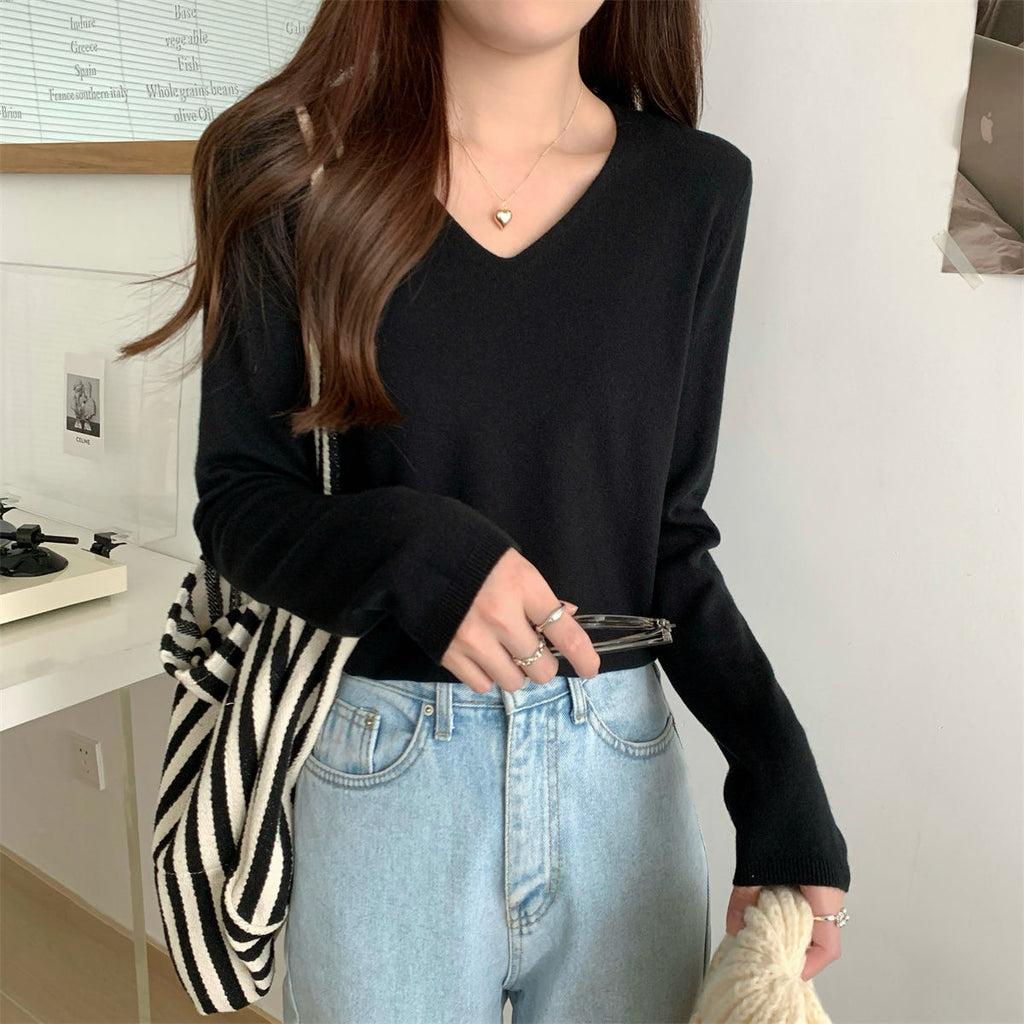 Women's loose V-neck cozy sweater by Dropshipman, soft and perfect for layering, shown in a comfortable fit.