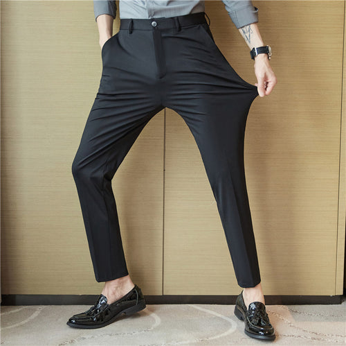 Slim-fit casual solid-color pants from Dropshipman, displayed in a natural pose, showing the fit and fabric texture.