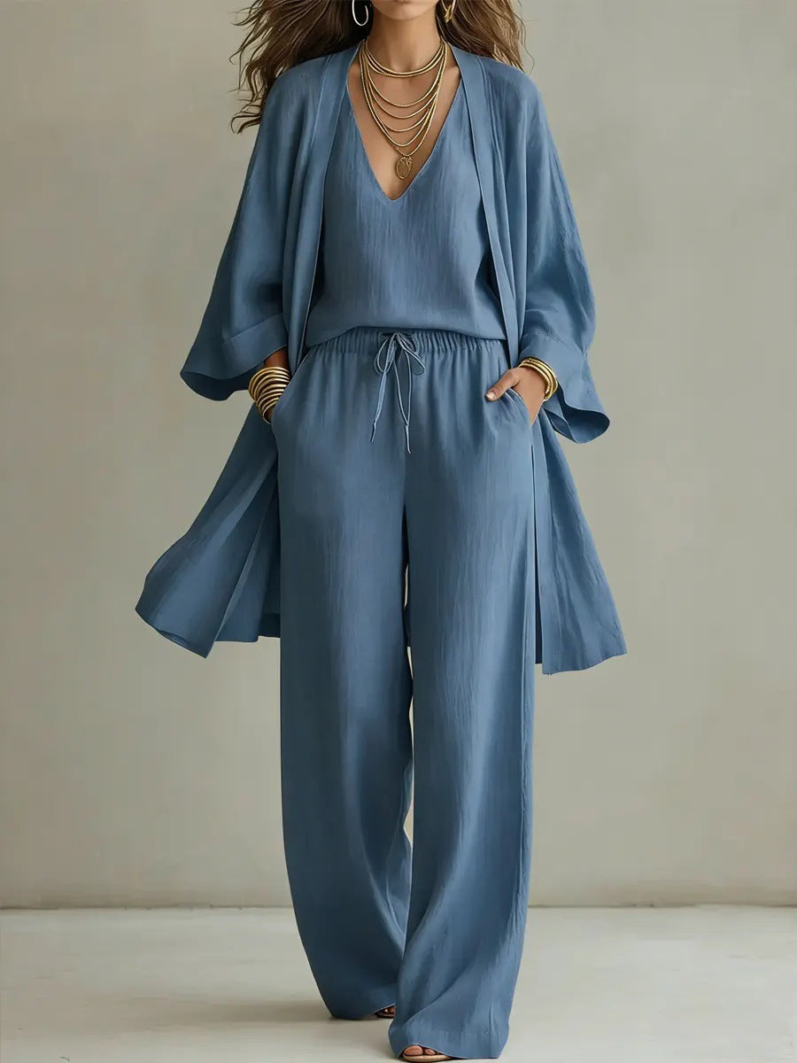 Dropshipman women's solid color V-neck cardigan vest with pockets, paired with long pants in a three-piece set.