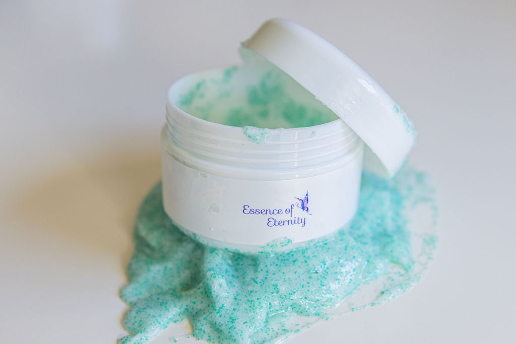 Essence of Eternity Peppermint Facial Scrub in a 30g jar, showing the textured scrub with peppermint leaves and natural skincare ingredients.