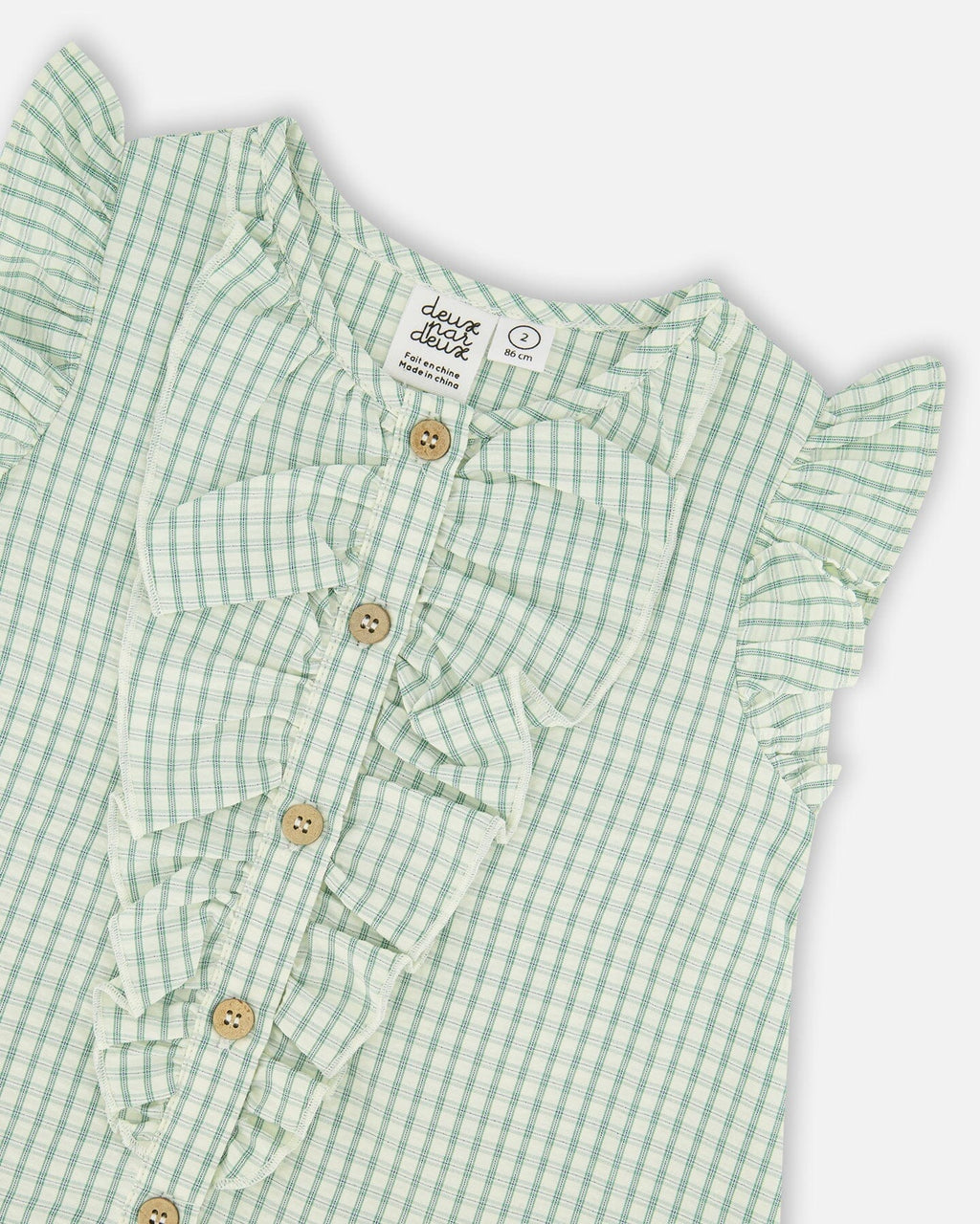 Green plaid poplin dress by Deux par Deux, featuring a classic pattern and stylish design, perfect for casual or semi-formal wear.