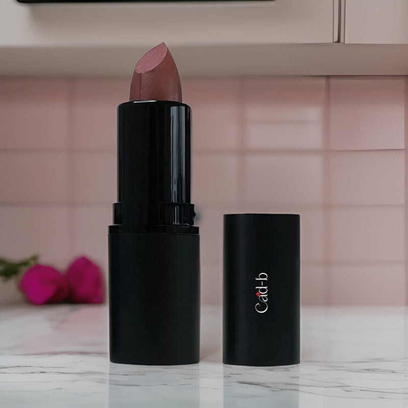 Cad b cruelty-free lipstick in Spicy Rum shade, hydrating with beeswax, jojoba, and castor oils, paraben-free and natural.