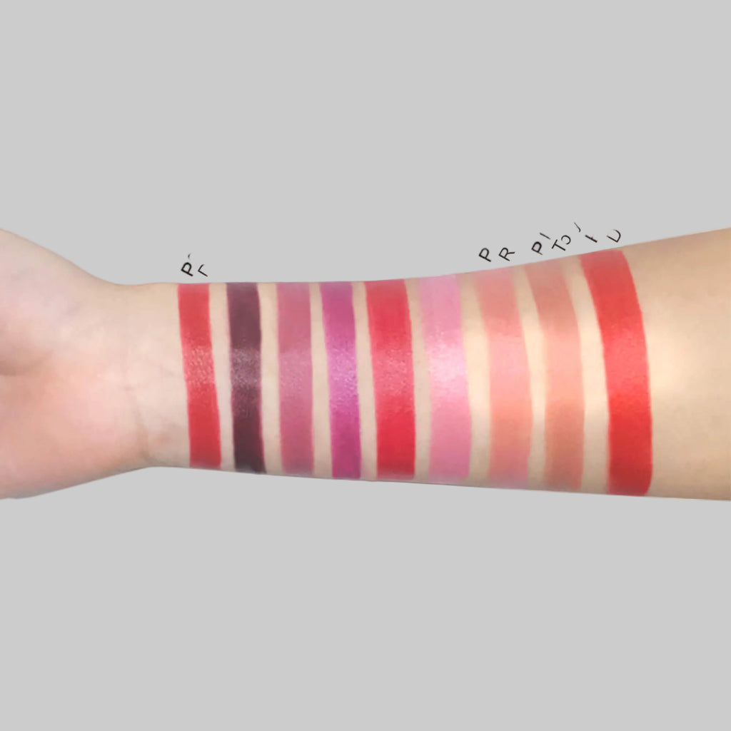 Swatches of Cad b creamy lipstick with Vitamin E showing hydrating, long-lasting color on lips and skin.