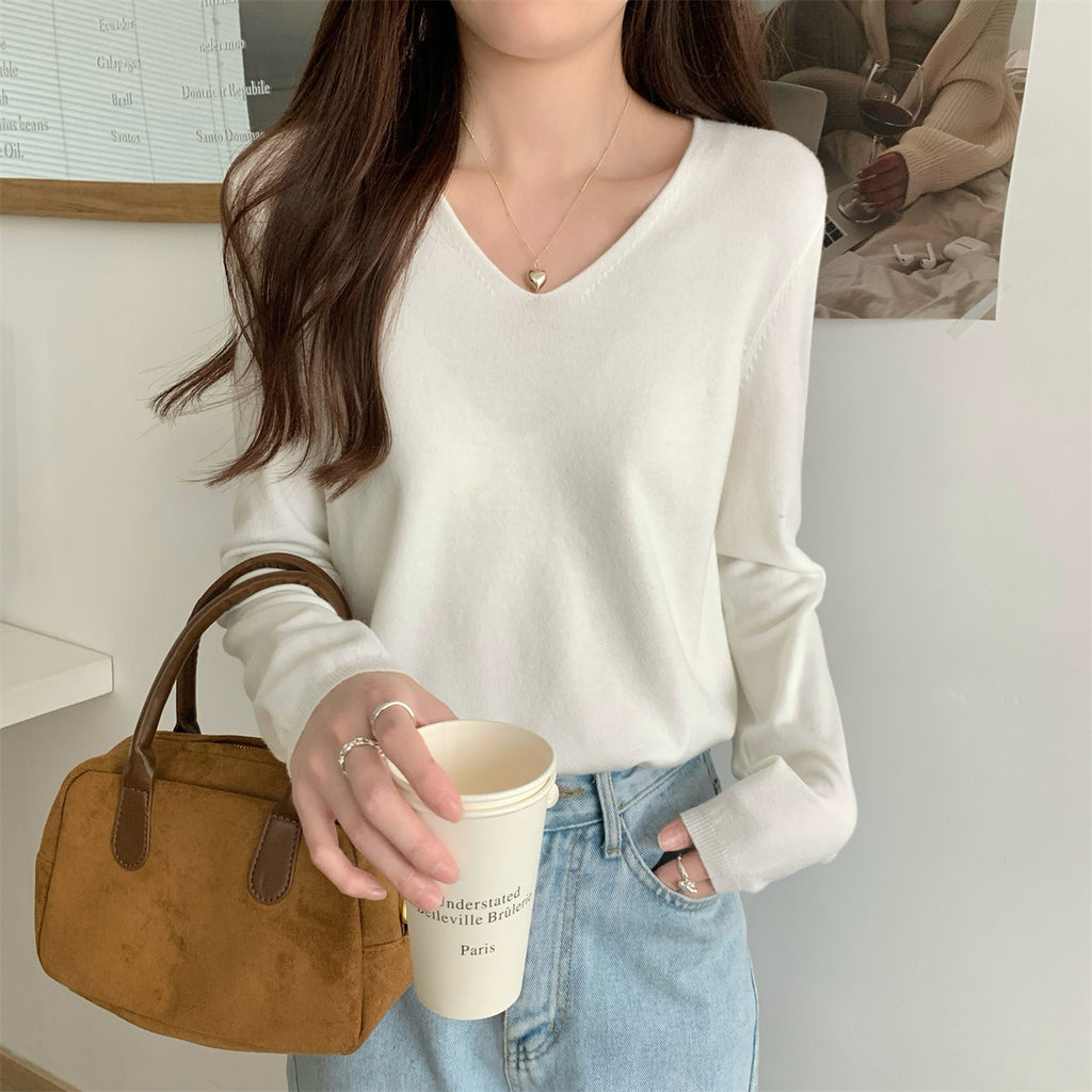 Women's loose V-neck cozy sweater by Dropshipman, soft and perfect for layering, shown in a comfortable, relaxed fit.
