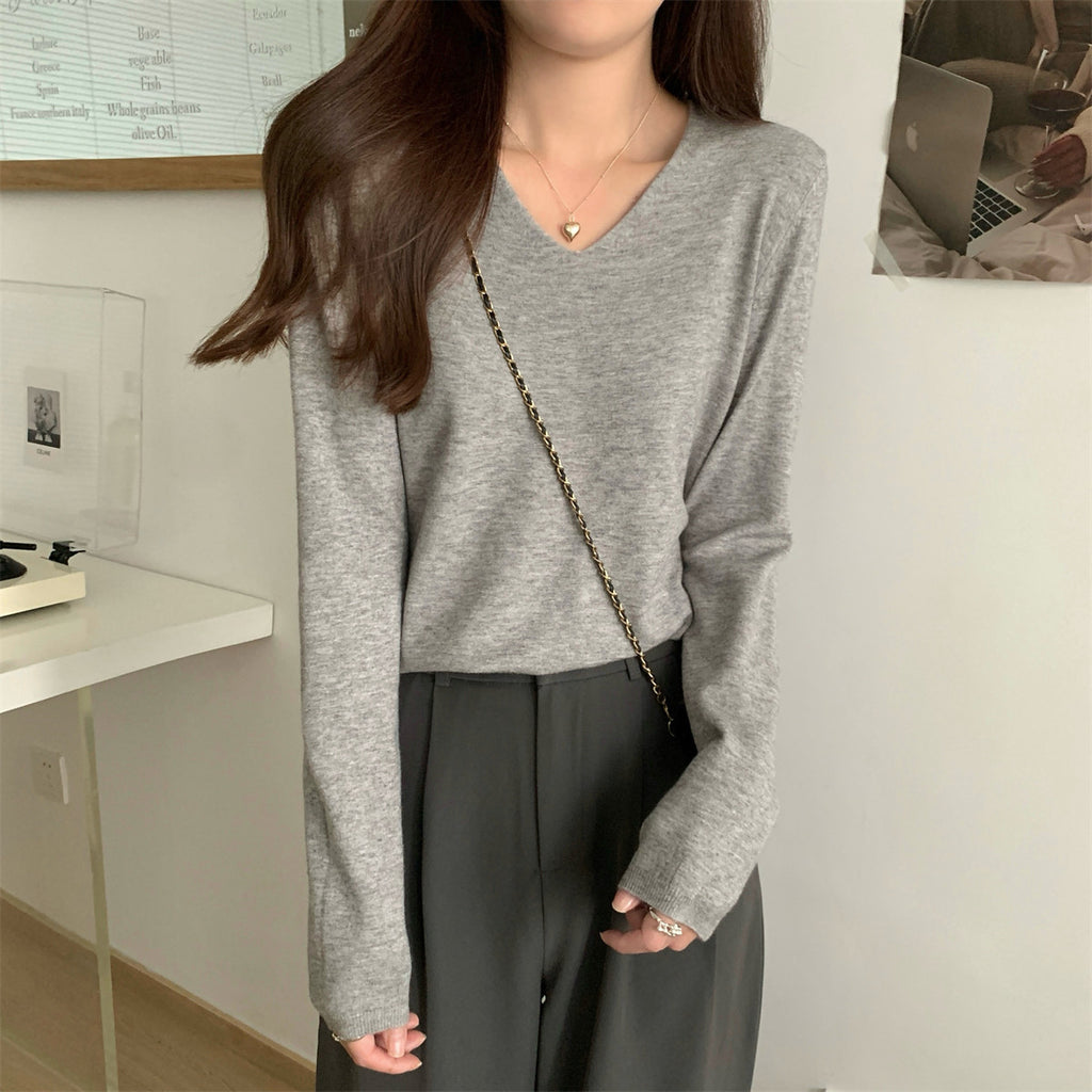 Women's loose V-neck cozy sweater by Dropshipman, soft and perfect for layering, shown in a comfortable fit and neutral color.