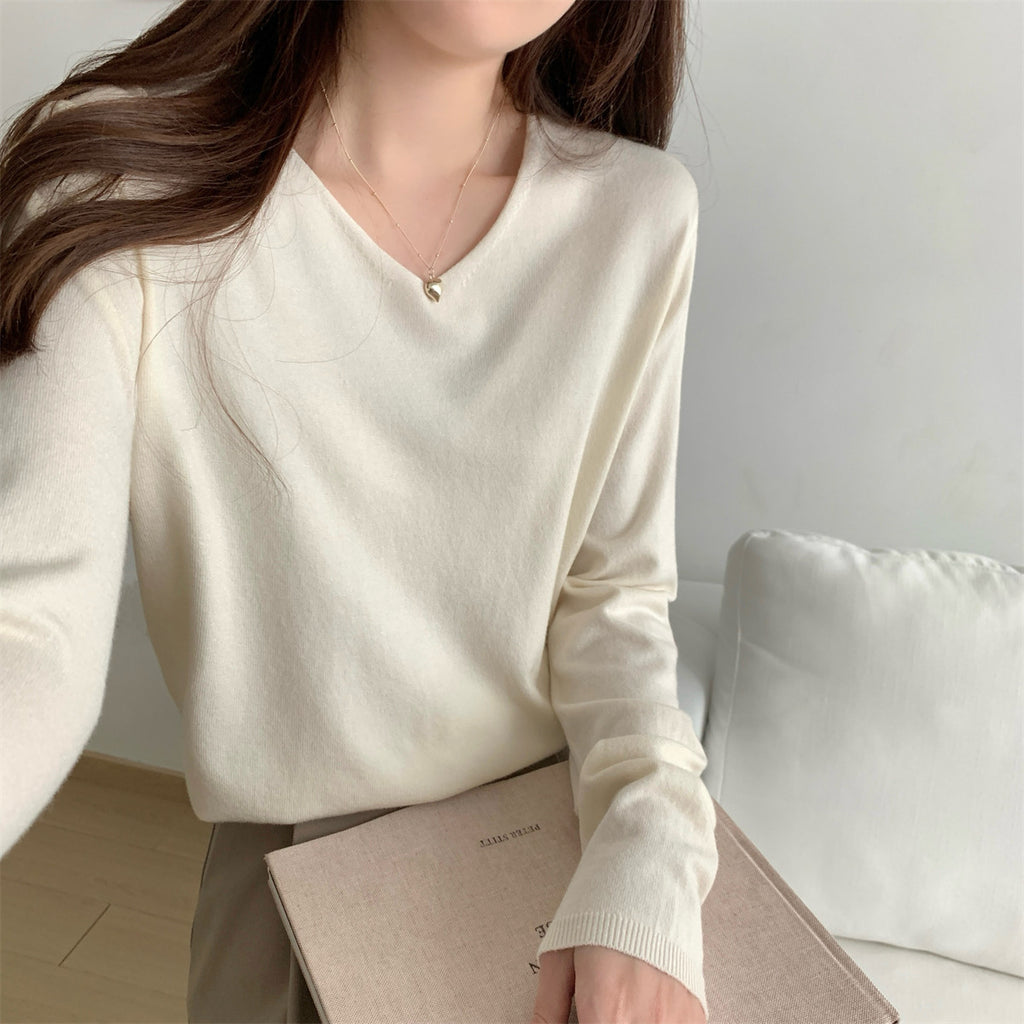 Women's loose V-neck cozy sweater from Dropshipman, soft knit fabric, perfect for layering and casual wear.
