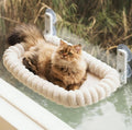 Suction-cup cat hammock window bed by Dropshipman, showing a cozy space for cats to rest comfortably on a window perch.