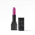 Laila Purple Rain lipstick in bold purple shade with natural oils, displayed in a sleek tube with the cap off.
